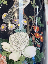A pair of Japanese silver-wired cloisonn&eacute; enamel vases with birds among flowering branches, Meiji period, 19th C.
