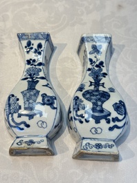 A pair of Chinese blue and white 'Antiquities' wall pocket vases, Kangxi