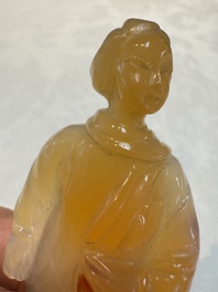 A group of ten Chinese hardstone and cherry amber carvings, 20th C.