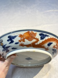 A Chinese blue and white iron-red-decorated 'Dragon' plate, Jing Jin Tang 精進堂 mark, 19th C.