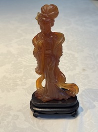 A group of ten Chinese hardstone and cherry amber carvings, 20th C.