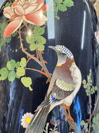 A pair of Japanese silver-wired cloisonn&eacute; enamel vases with birds among flowering branches, Meiji period, 19th C.