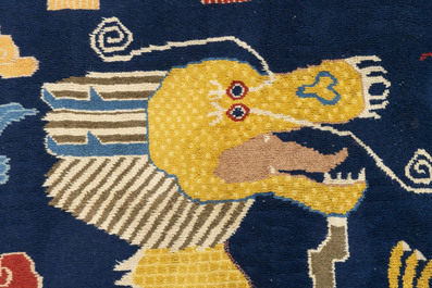 A Sino-Tibetan inscribed woollen 'Dragon' pillar carpet, 19th C.
