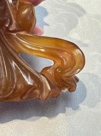A group of ten Chinese hardstone and cherry amber carvings, 20th C.