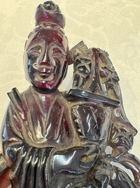 A group of ten Chinese hardstone and cherry amber carvings, 20th C.