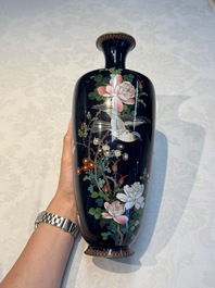 A pair of Japanese silver-wired cloisonn&eacute; enamel vases with birds among flowering branches, Meiji period, 19th C.