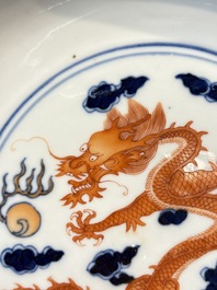 A Chinese blue and white iron-red-decorated 'Dragon' plate, Jing Jin Tang 精進堂 mark, 19th C.