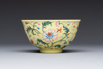 A Chinese famille rose sgraffito lemon-yellow-ground 'Flower Scrolls' bowl, Qianlong mark, 20th C.