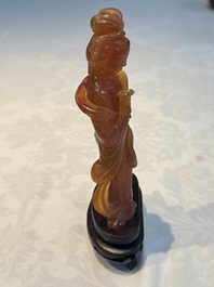 A group of ten Chinese hardstone and cherry amber carvings, 20th C.