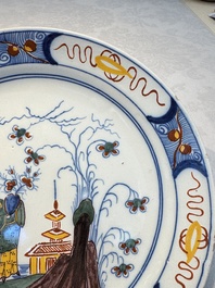 A blue and white Dutch Delft covered vase and two polychrome plates, 17/18th C.