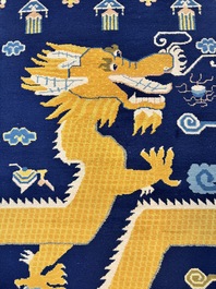 A Sino-Tibetan woollen 'Dragon' pillar carpet, 19th C.