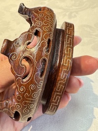 A group of ten Chinese hardstone and cherry amber carvings, 20th C.