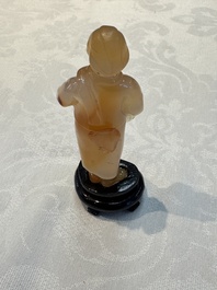 A group of ten Chinese hardstone and cherry amber carvings, 20th C.