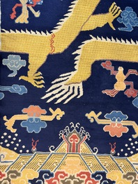 A Sino-Tibetan inscribed woollen 'Dragon' pillar carpet, 19th C.