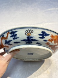 A Chinese blue and white iron-red-decorated 'Dragon' plate, Jing Jin Tang 精進堂 mark, 19th C.