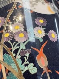 A pair of Japanese silver-wired cloisonn&eacute; enamel vases with birds among flowering branches, Meiji period, 19th C.