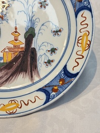 A blue and white Dutch Delft covered vase and two polychrome plates, 17/18th C.