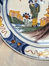 A blue and white Dutch Delft covered vase and two polychrome plates, 17/18th C.