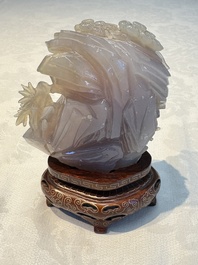 A group of ten Chinese hardstone and cherry amber carvings, 20th C.