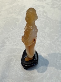A group of ten Chinese hardstone and cherry amber carvings, 20th C.