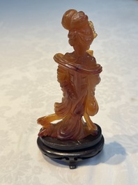 A group of ten Chinese hardstone and cherry amber carvings, 20th C.