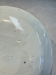 A blue and white Dutch Delft covered vase and two polychrome plates, 17/18th C.