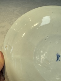 A blue and white Dutch Delft covered vase and two polychrome plates, 17/18th C.