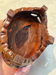 A group of ten Chinese hardstone and cherry amber carvings, 20th C.