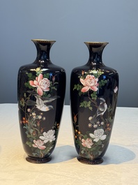 A pair of Japanese silver-wired cloisonn&eacute; enamel vases with birds among flowering branches, Meiji period, 19th C.