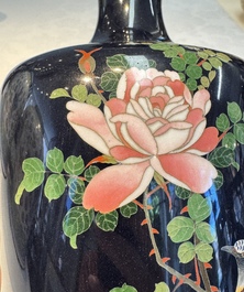 A pair of Japanese silver-wired cloisonn&eacute; enamel vases with birds among flowering branches, Meiji period, 19th C.