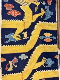 A Sino-Tibetan inscribed woollen 'Dragon' pillar carpet, 19th C.