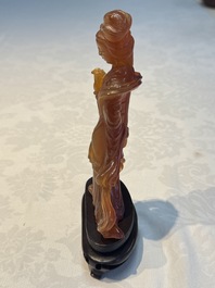 A group of ten Chinese hardstone and cherry amber carvings, 20th C.