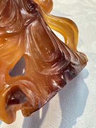 A group of ten Chinese hardstone and cherry amber carvings, 20th C.