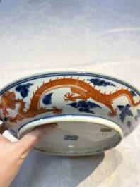 A Chinese blue and white iron-red-decorated 'Dragon' plate, Jing Jin Tang 精進堂 mark, 19th C.