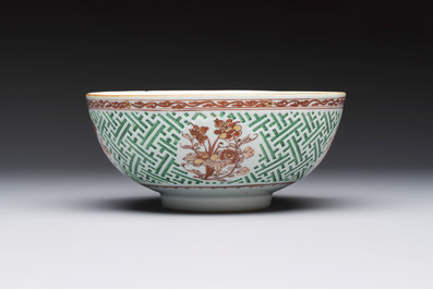 A Chinese famille verte relief-carved bowl with gilt iron-red floral design, Kangxi