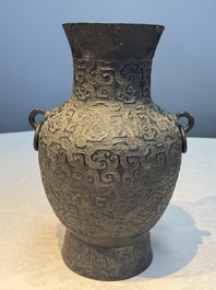 A Chinese archaistic bronze vase with Taotie handles, 'Hu 壺', Ming