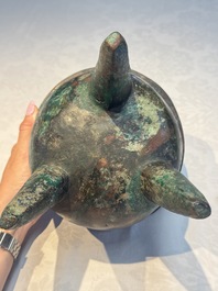 A Chinese archaic bronze ritual tripod food vessel, 'Li 鬲', early Shang