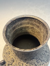 A Chinese archaistic bronze vase with Taotie handles, 'Hu 壺', Ming