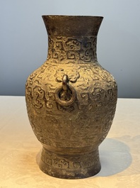 A Chinese archaistic bronze vase with Taotie handles, 'Hu 壺', Ming