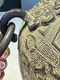 A Chinese archaistic bronze vase with Taotie handles, 'Hu 壺', Ming