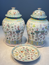 A pair of Chinese famille rose 'Antiquities' covered vases and a dish, 19th C.