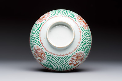 A Chinese famille verte relief-carved bowl with gilt iron-red floral design, Kangxi