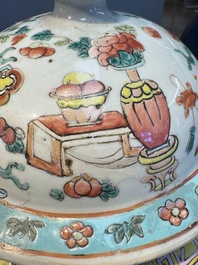 A pair of Chinese famille rose 'Antiquities' covered vases and a dish, 19th C.