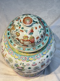 A pair of Chinese famille rose 'Antiquities' covered vases and a dish, 19th C.