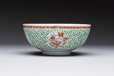 A Chinese famille verte relief-carved bowl with gilt iron-red floral design, Kangxi