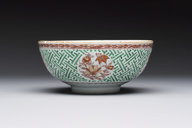A Chinese famille verte relief-carved bowl with gilt iron-red floral design, Kangxi