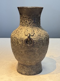 A Chinese archaistic bronze vase with Taotie handles, 'Hu 壺', Ming