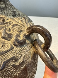 A Chinese archaistic bronze vase with Taotie handles, 'Hu 壺', Ming