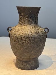 A Chinese archaistic bronze vase with Taotie handles, 'Hu 壺', Ming