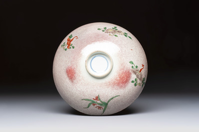 An unusual Chinese famille verte copper-red-ground shallow bowl with floral design, 19th C.